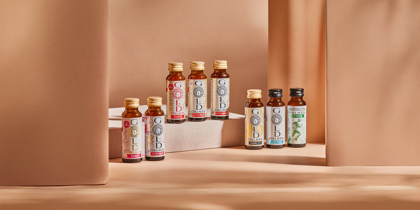 8 different Gold Collagen bottles arrayed artfully on a platform base