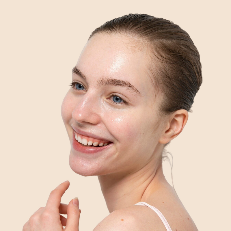 Woman with a radiant smile on a beige background