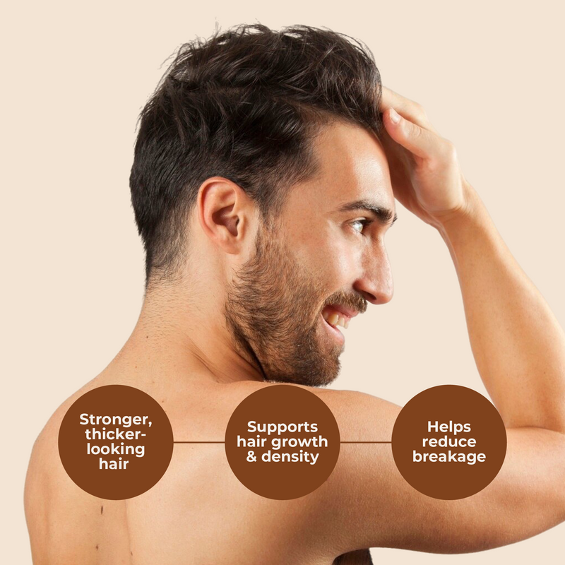 Man with a beard and short hair touching his head, with text about hair care benefits on a beige background