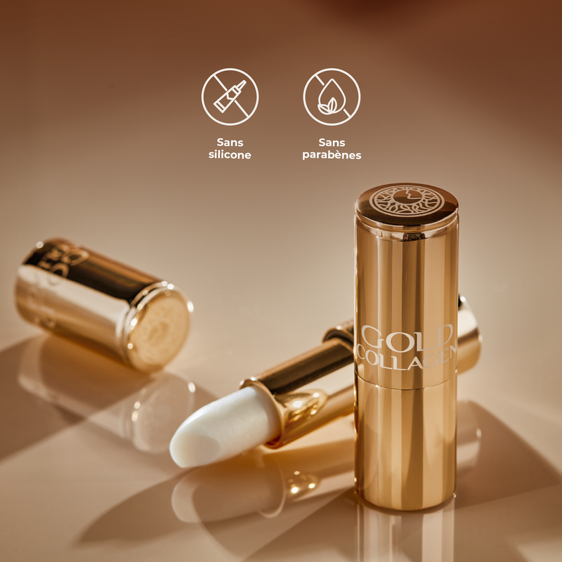 Gold lipstick with 'Gold Collagen' branding on a reflective surface, featuring icons and text indicating ingredient-free status.